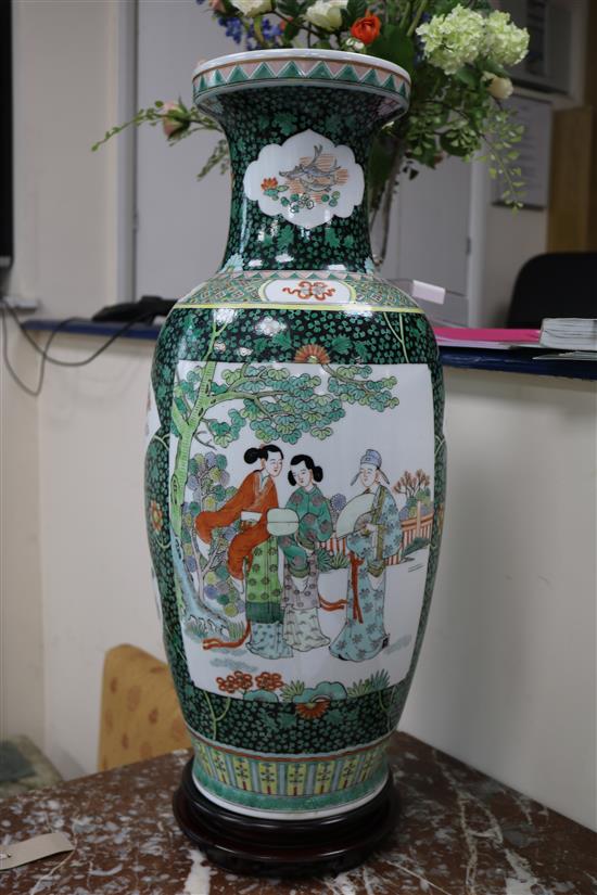 A pair of large Chinese porcelain vases with hardwood stands